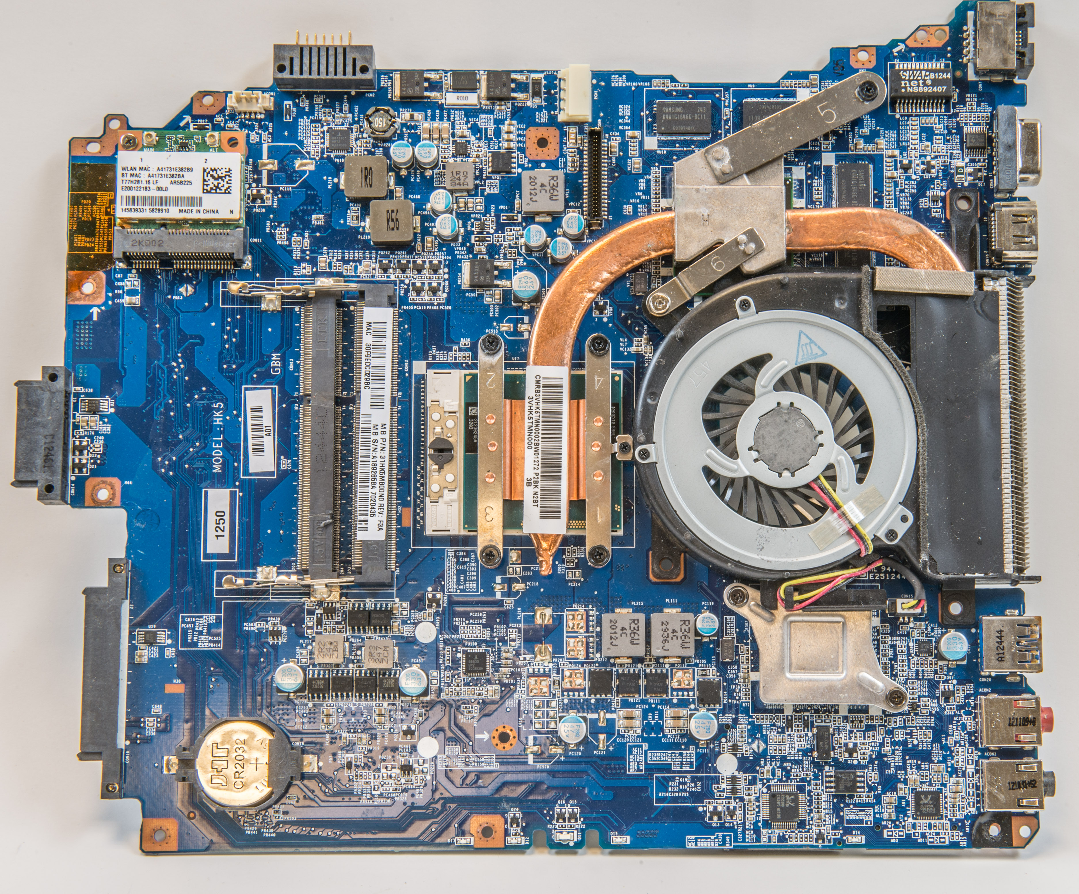 Laptop circuit board with cooling fan, copper heat pipes and memory slots